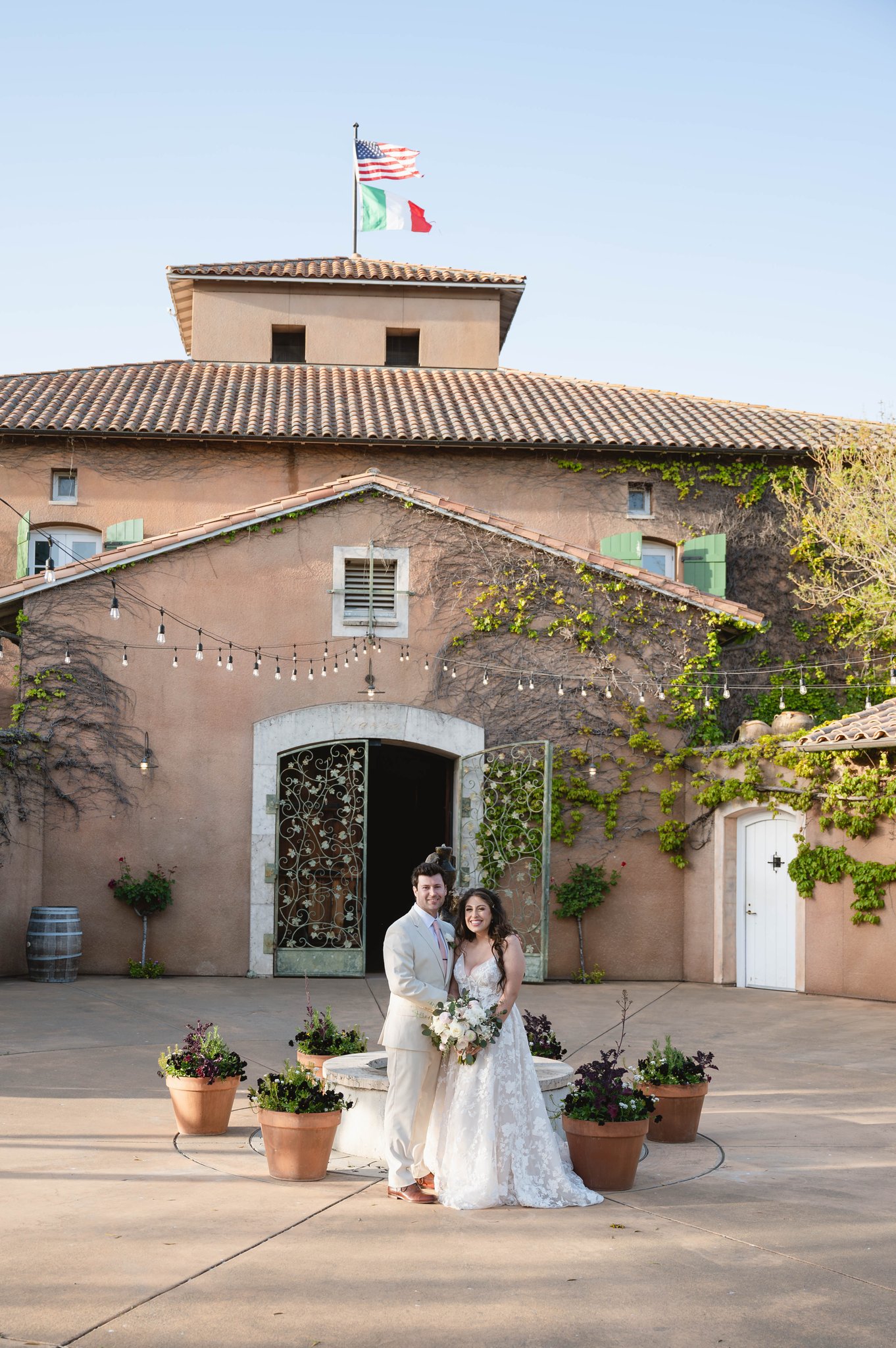 Italian themed wedding. Couple standing in front of vianse winery sonoma, california